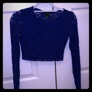 Blue laced long sleeve crop top.